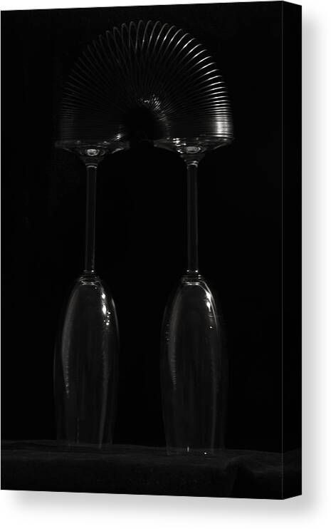 Fine Art Still Life Black White Champagne Flute Wine Glass Slinky Canvas Print featuring the photograph Balancing Act #1 by Andrew Wohl