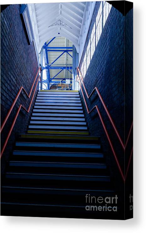 Britain Canvas Print featuring the photograph Steps up leading from dark to light with red hand rail. #2 by Peter Noyce