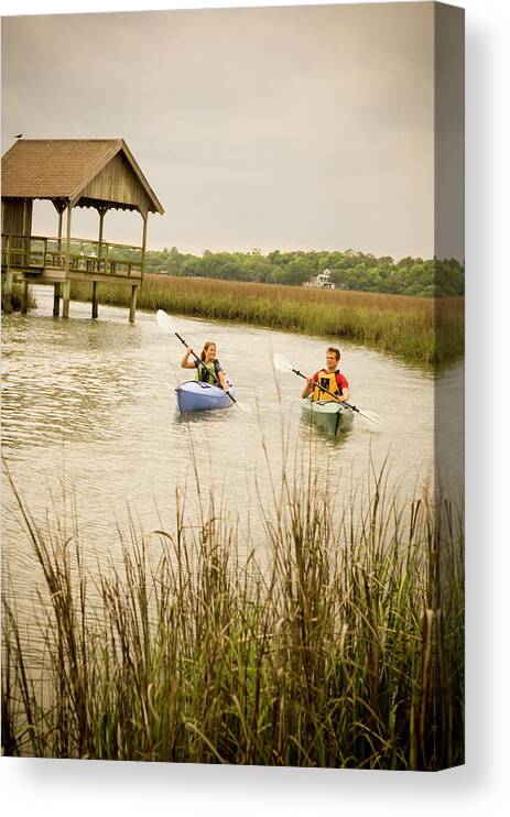 Adventure Canvas Print featuring the photograph A Couple Paddles Kayaks Together by David Nevala