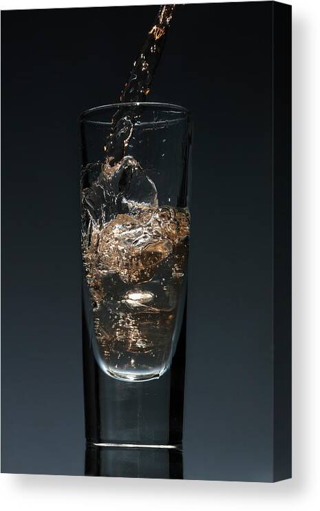 Orange Color Canvas Print featuring the photograph A Drink Being Poured Into A Glass by Dual Dual