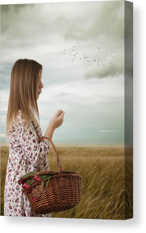Young Canvas Print featuring the photograph Young Girl Walking Through A Meadow With A Basket Of Flowers by Ethiriel Photography