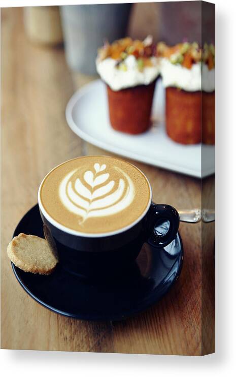 Bakery Canvas Print featuring the photograph Cup Of Coffee With Leaf Pattern On by Jake Curtis