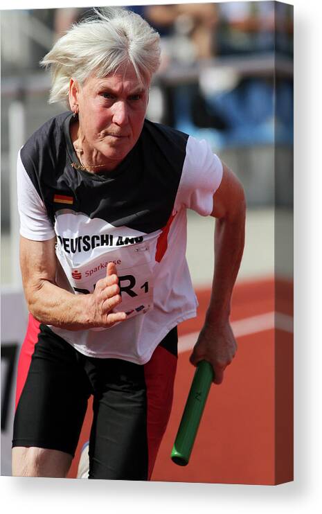 One Person Canvas Print featuring the photograph Determined Female Senior Athlete Running by Alex Rotas