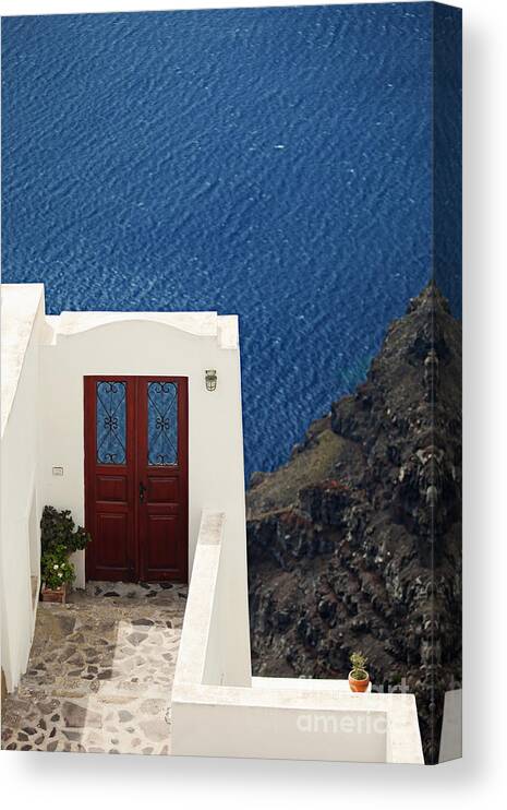 Santorini Canvas Print featuring the photograph Door facing the Aegean sea by Aiolos Greek Collections