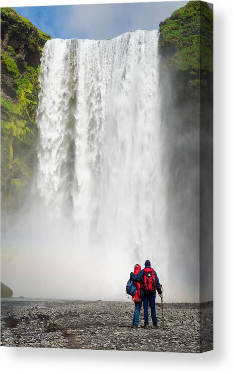 Iceland Canvas Print featuring the photograph Enjoying Skogafoss waterfall in Iceland by Matthias Hauser