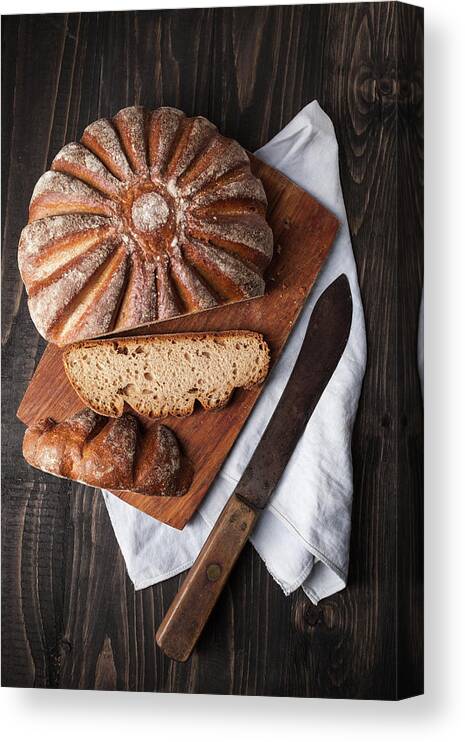 Cutting Board Canvas Print featuring the photograph Fresh Baked Bread On Chopping Board by Westend61