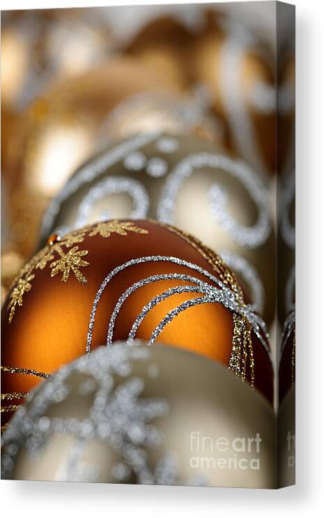 Christmas Canvas Print featuring the photograph Gold Christmas ornaments by Elena Elisseeva