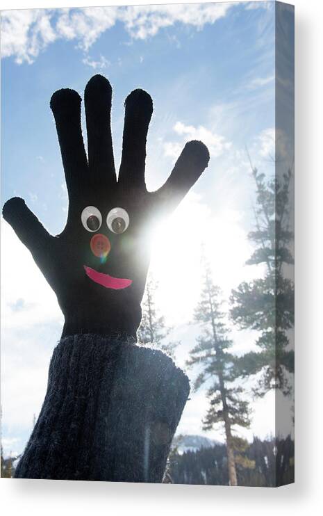 Mature Adult Canvas Print featuring the photograph Googly Eyed Smiley Face On Black Glove by Mimi Haddon
