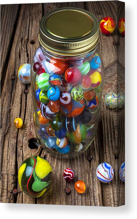 Jar Canvas Print featuring the photograph Jar of marbles with shooter by Garry Gay