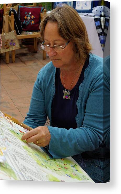 Embroidery Canvas Print featuring the photograph Lady embroiderer 2 by Ron Harpham