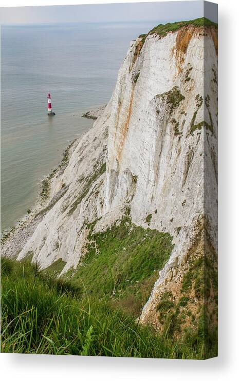 Tranquility Canvas Print featuring the photograph Lighthouse Under Some Cliffs Next To by Gerard Puigmal