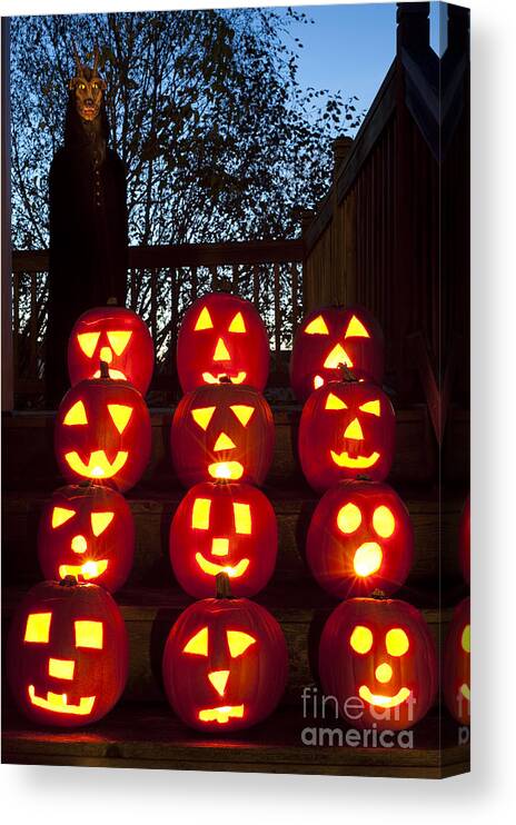 31st Canvas Print featuring the photograph Lit Pumpkins with Demon on Halloween #1 by Jim Corwin