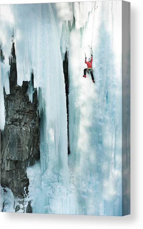 Sports Helmet Canvas Print featuring the photograph Male Ice Climber Scales Big Ice-covered by Kjell Linder