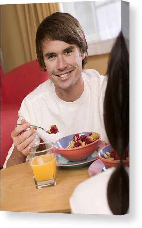 Breakfast Canvas Print featuring the photograph Man having breakfast by Comstock Images