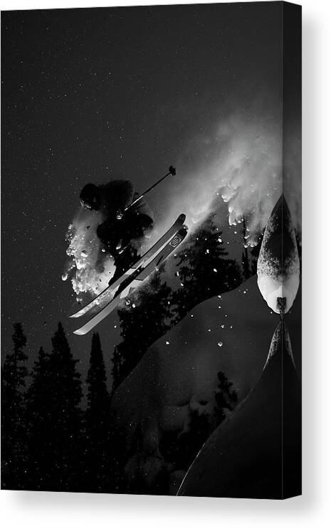 25-29 Years Canvas Print featuring the photograph Man Jumping On Skis by Adam Clark