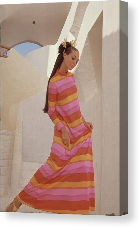 Fashion Canvas Print featuring the photograph Marisa Berenson In A Bright Striped Dress by Henry Clarke