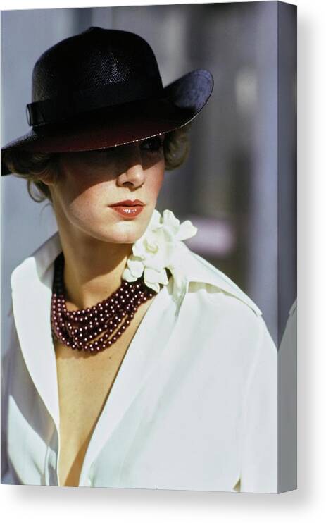 Accessories Canvas Print featuring the photograph Model Wearing A Hat And Beads by Arthur Elgort