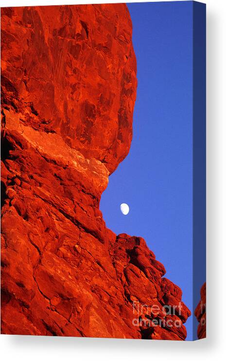North America Canvas Print featuring the photograph Moonrise Balanced Rock Arches National Park Utah by Dave Welling