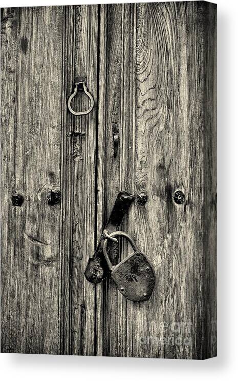 Abstract Canvas Print featuring the photograph Old Weathered Door by Nicola Fiscarelli