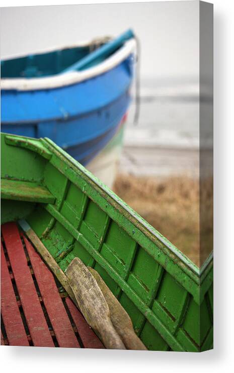 Painted Canvas Print featuring the photograph Paddles In A Colourful Wooden Rowboat by John Short