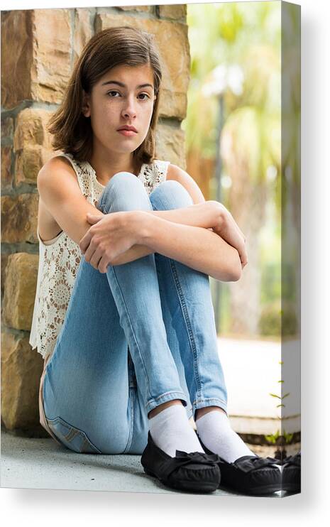 Sitting On Floor Canvas Print featuring the photograph Serious girl by Juanmonino