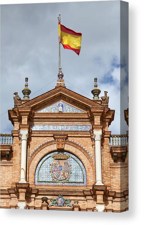 Spanish Canvas Print featuring the photograph Spanish Flag and Crest on Plaza de Espana Pavilion in Seville by Artur Bogacki