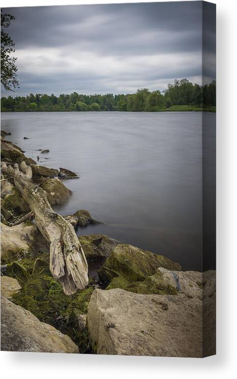 Frederick Law Olmsted Canvas Print featuring the photograph Still Waters under a grey sky by Chris Bordeleau