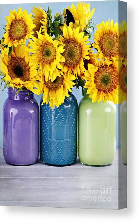 Beautiful Canvas Print featuring the photograph Sunflowers in Painted Mason Jars by Stephanie Frey