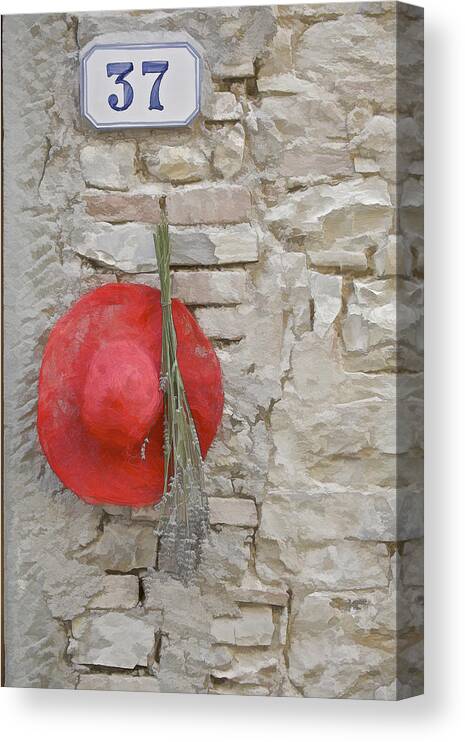 Europe Canvas Print featuring the photograph The Hanging Red Hat by David Letts