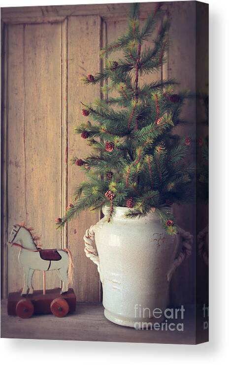 Decoration Canvas Print featuring the photograph Toy horse with Christmas tree on table by Sandra Cunningham