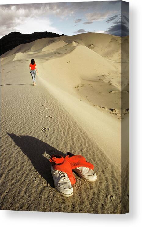 Eureka Dunes Canvas Print featuring the photograph Woman Walking Barefoot Across Sand Dunes by Peter Menzel/science Photo Library