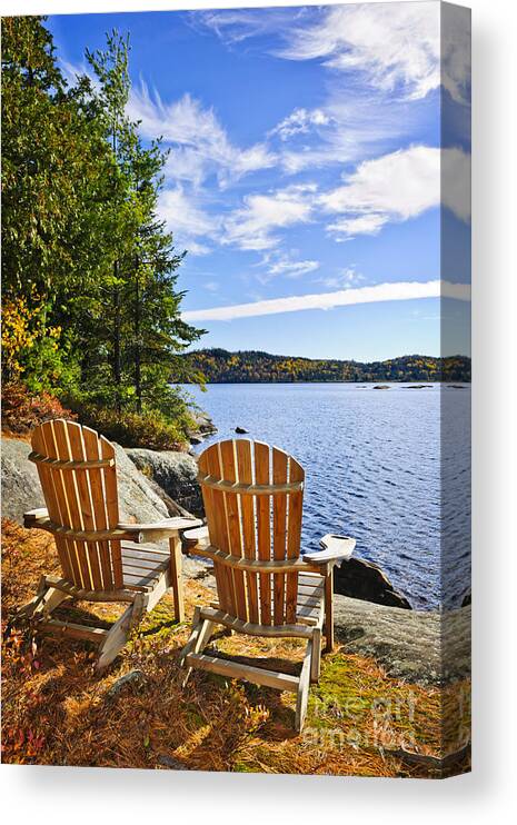 Chairs Canvas Print featuring the photograph Adirondack chairs at lake shore 3 by Elena Elisseeva