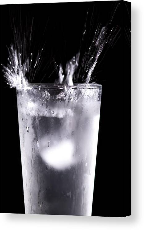 Ice Canvas Print featuring the photograph An Icy Splash by Sven Brogren