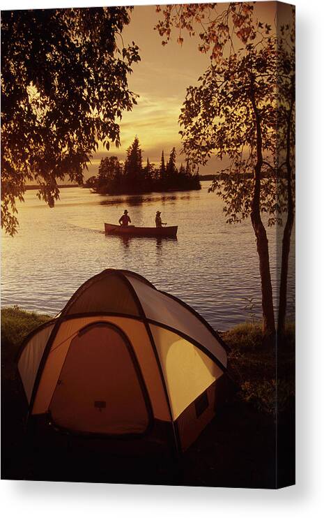 Back-light Canvas Print featuring the photograph Canoeing At Otter Falls, Whiteshell by Dave Reede