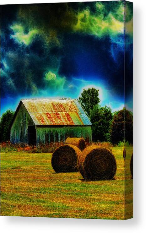 Field Canvas Print featuring the photograph Spooky Hay Field by Bill and Linda Tiepelman