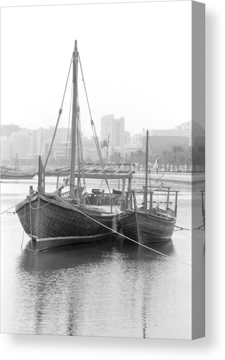 Doha Canvas Print featuring the photograph Traditional dhows in Doha Bay by Paul Cowan