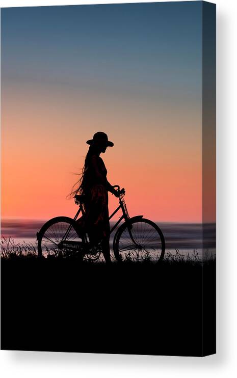 Devon Canvas Print featuring the photograph Silhouette Of Girl And Bike At Sunset Near The Sea. by Maggie Mccall