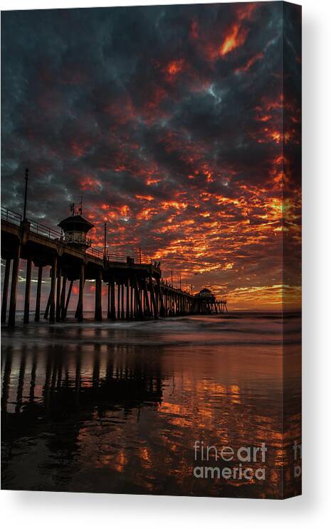 Beach Canvas Print featuring the photograph Sunset over Huntington Beach Pier #2 by Peter Dang