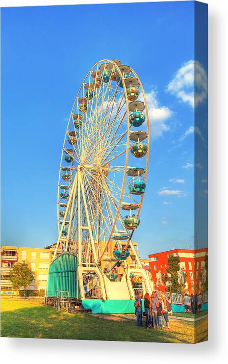 Action Canvas Print featuring the photograph A Big Ferris Wheel On A Carnival by Gina Koch