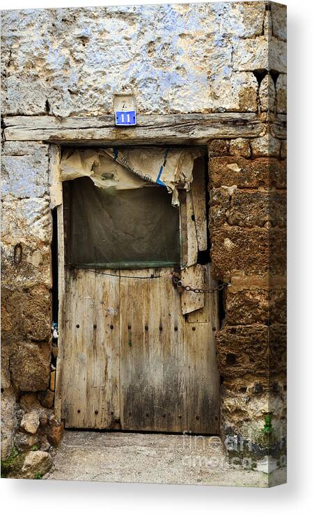 Brown Canvas Print featuring the photograph Antique damaged door by RicardMN Photography