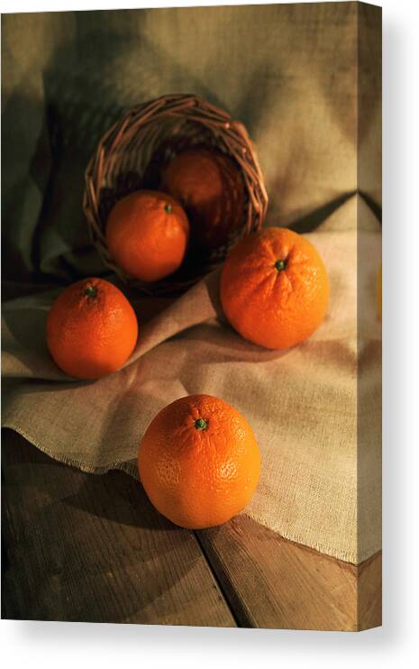 Basket Canvas Print featuring the photograph Basket of fresh tangerines by Jaroslaw Blaminsky