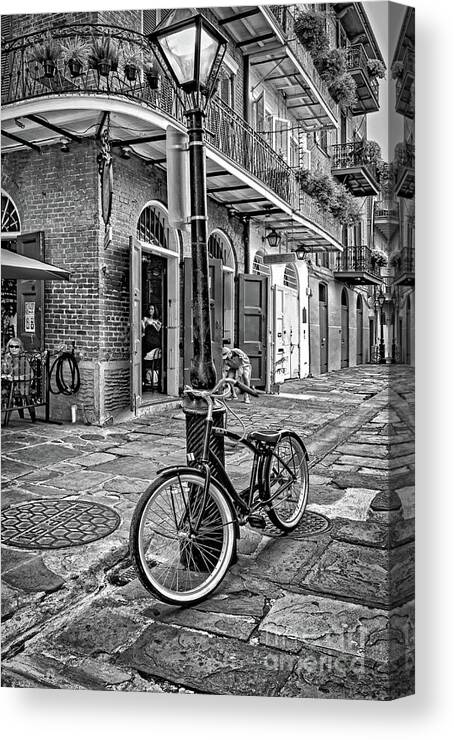 Bike Canvas Print featuring the photograph Bike and Lamppost in Pirate's Alley- BW by Kathleen K Parker