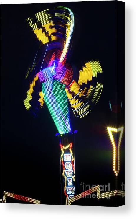 Art Deco Statues Canvas Print featuring the photograph Carnival Ride in Motion, The Texas State Fair by Greg Kopriva