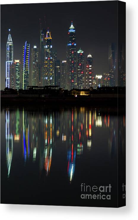 Dubai Canvas Print featuring the photograph Dubai city skyline nighttime by Andy Myatt