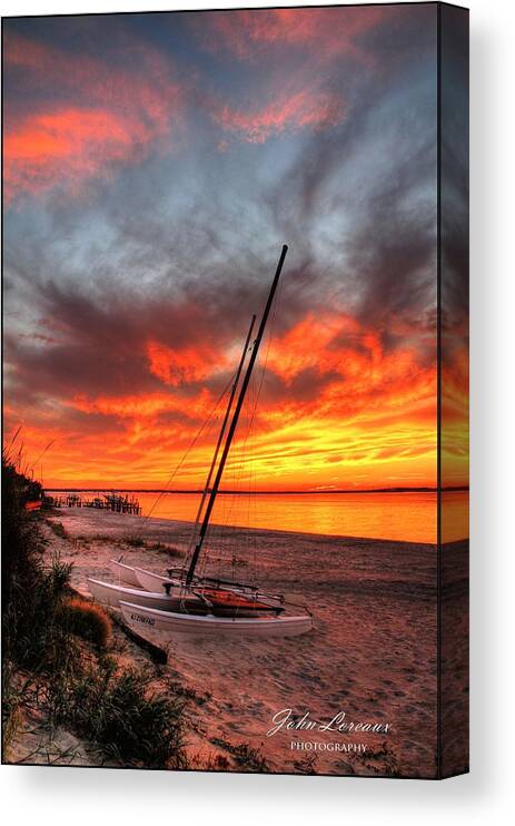 Sunset Canvas Print featuring the photograph Fiery Sunset by John Loreaux