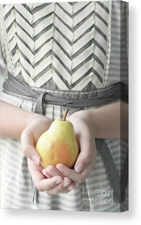 Girl Canvas Print featuring the photograph Hands holding yellow pear by Stephanie Frey