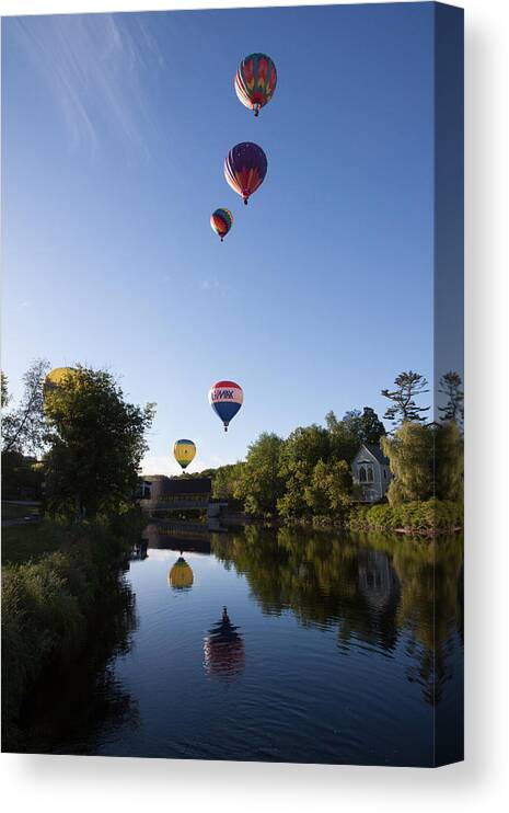 Quechee Covered Bridge Canvas Print featuring the photograph Hot air balloons playing follow the leader by Jeff Folger