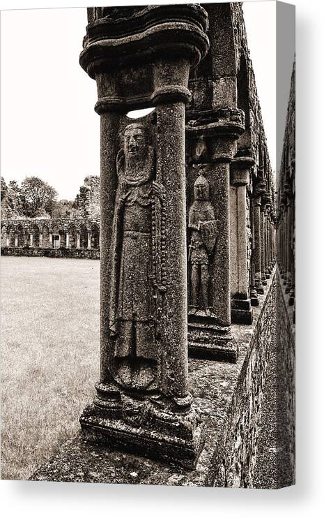 Jerpoint Abbey Canvas Print featuring the photograph Jerpoint Abbey Cloister Stone Figures by Menega Sabidussi