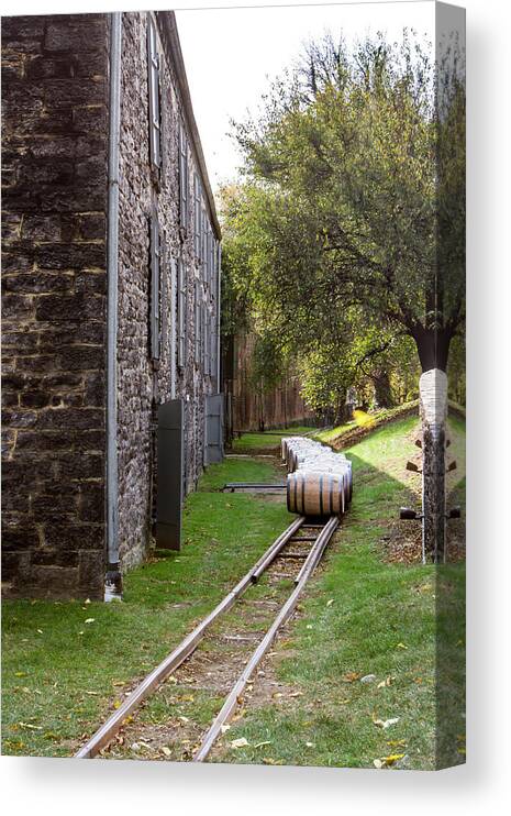 American Canvas Print featuring the photograph Oak barrels outside stone distillery by Karen Foley