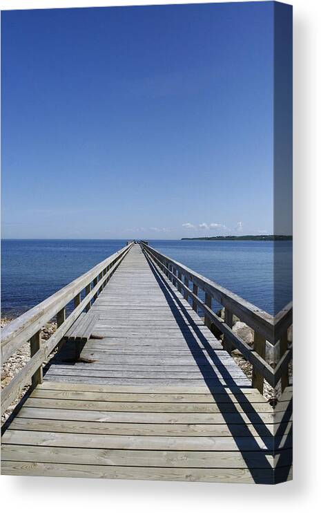 Fishing Pier Canvas Print featuring the photograph Pier On Fort Pond Bay Montauk by Christopher J Kirby